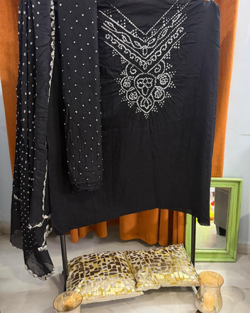 Black Bandhani Dress Material on a stand. 