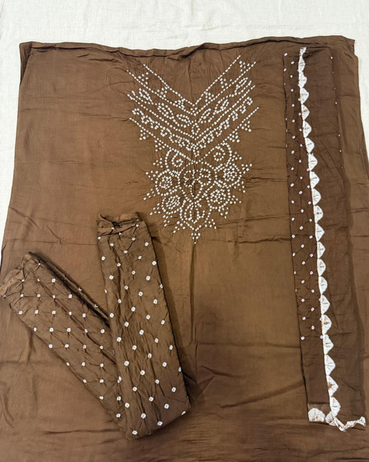 Brown bandhani fabric on a white background