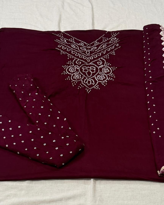 Maroon bandhani fabric on a white background