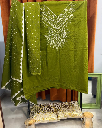 Mehandi Green Bandhani  fabric draped over a chair with a mirror in the background