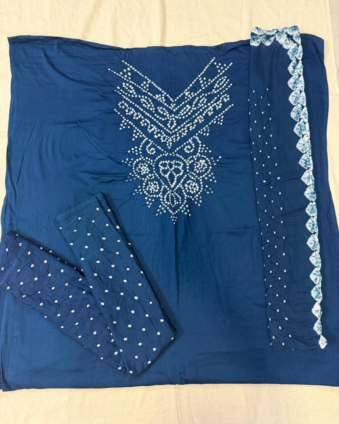 Navy Blue Bandhani  fabric on a beige background