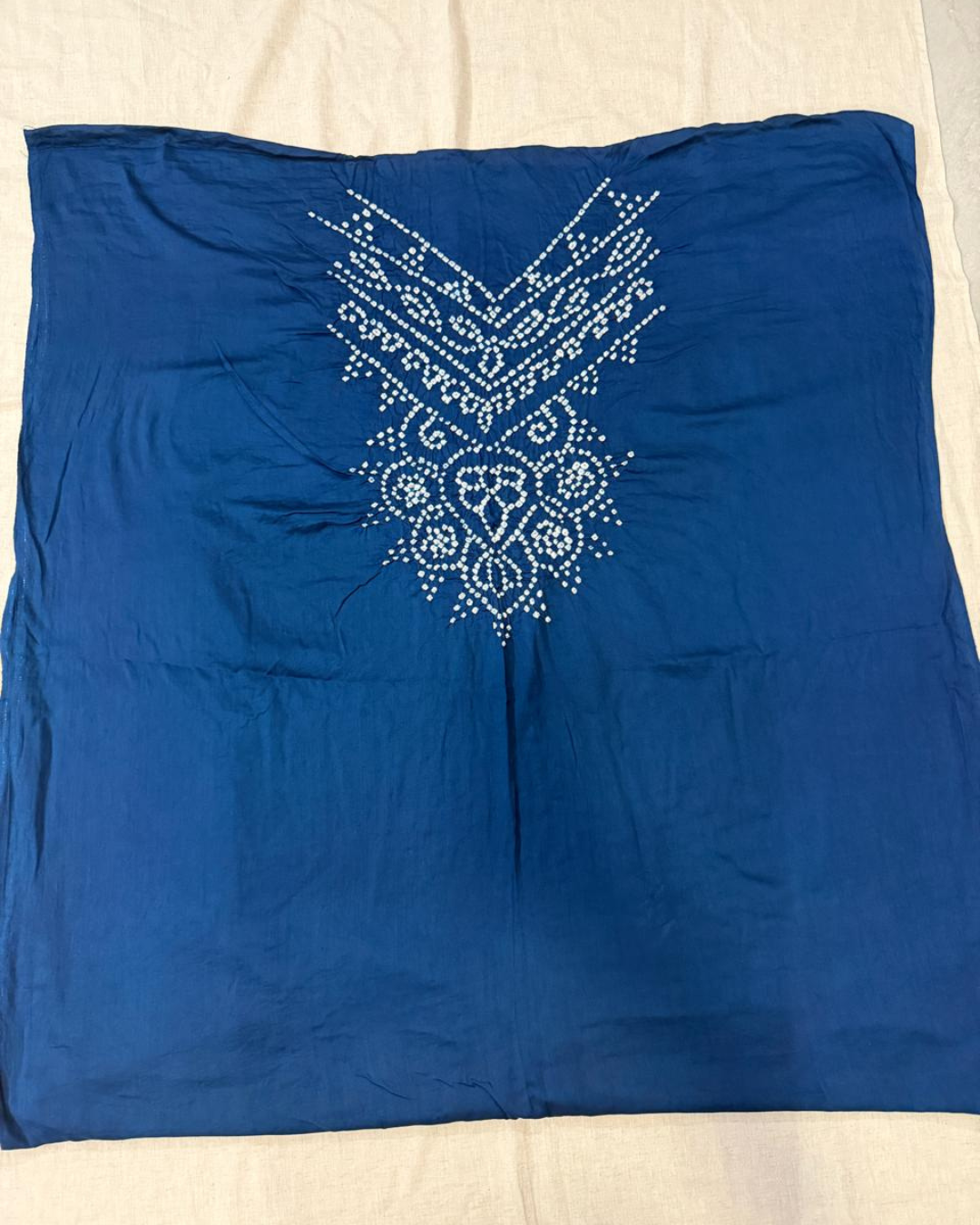 Navy Blue fabric with decorative white pattern on a beige background