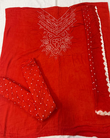Orange Bandhani fabric on a white background