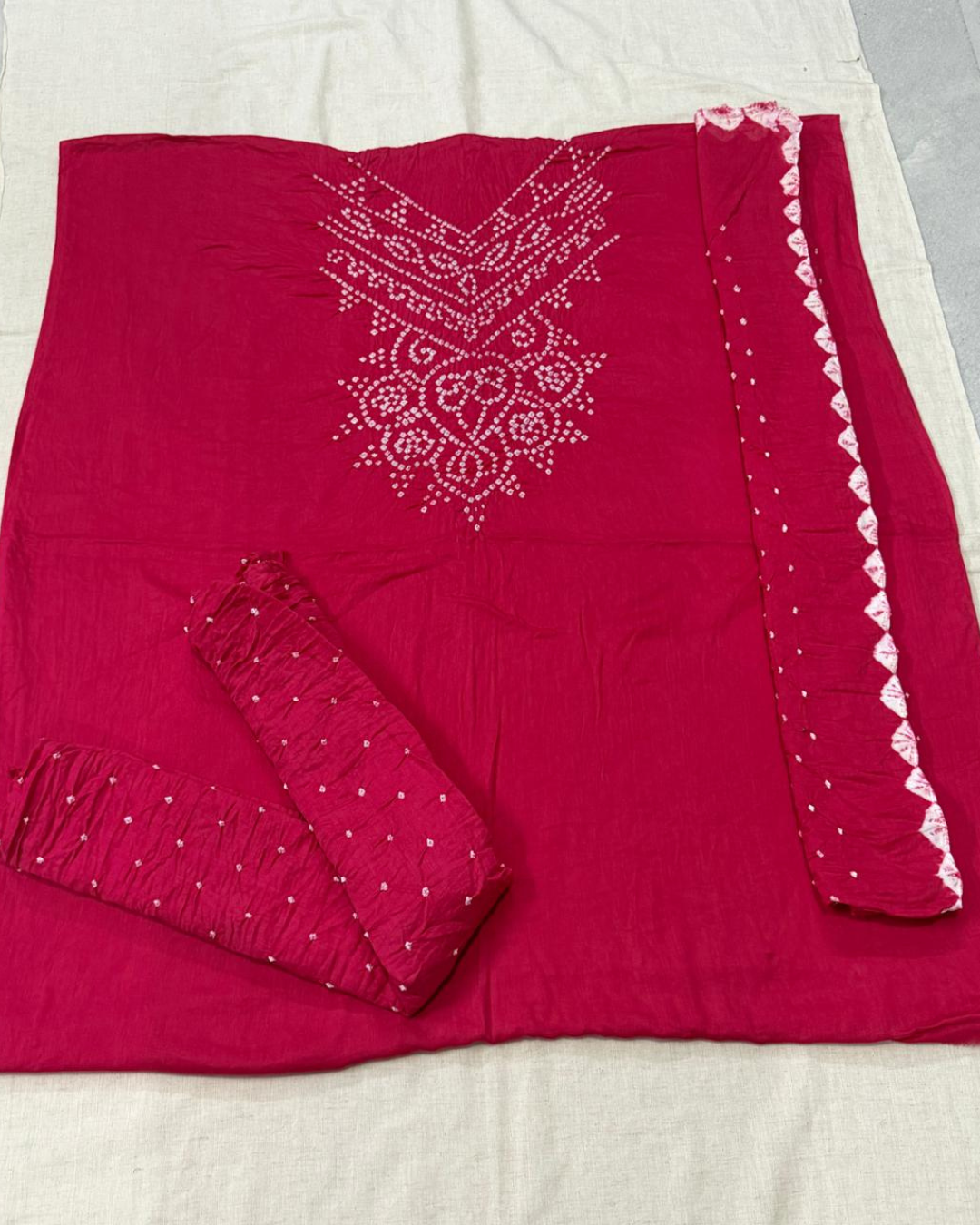 Pink Bandhani fabric on a light background
