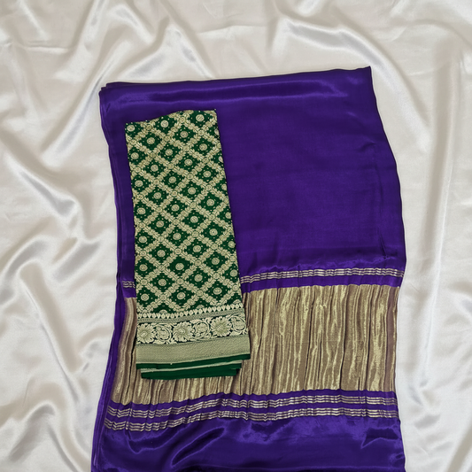 Purple saree with green and gold patterns blouse piece  on offwhite satin background