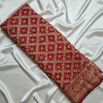 banarasi georgette red bandhani blouse piece flat lay on white fabric