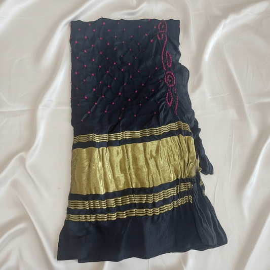 black bandhani blouse piece on off white satin background