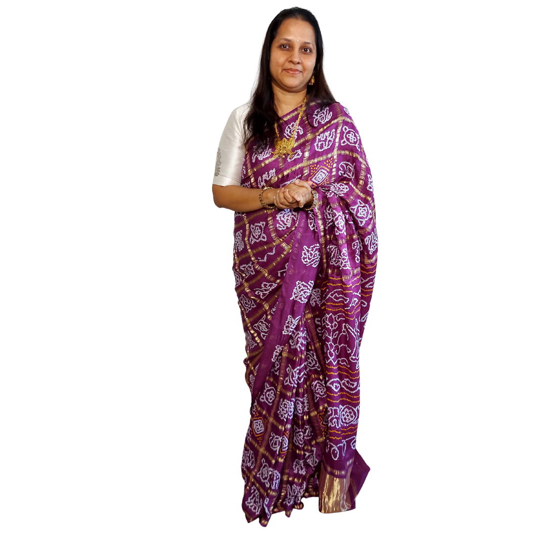 women in gharchola bandhani saree plain white background