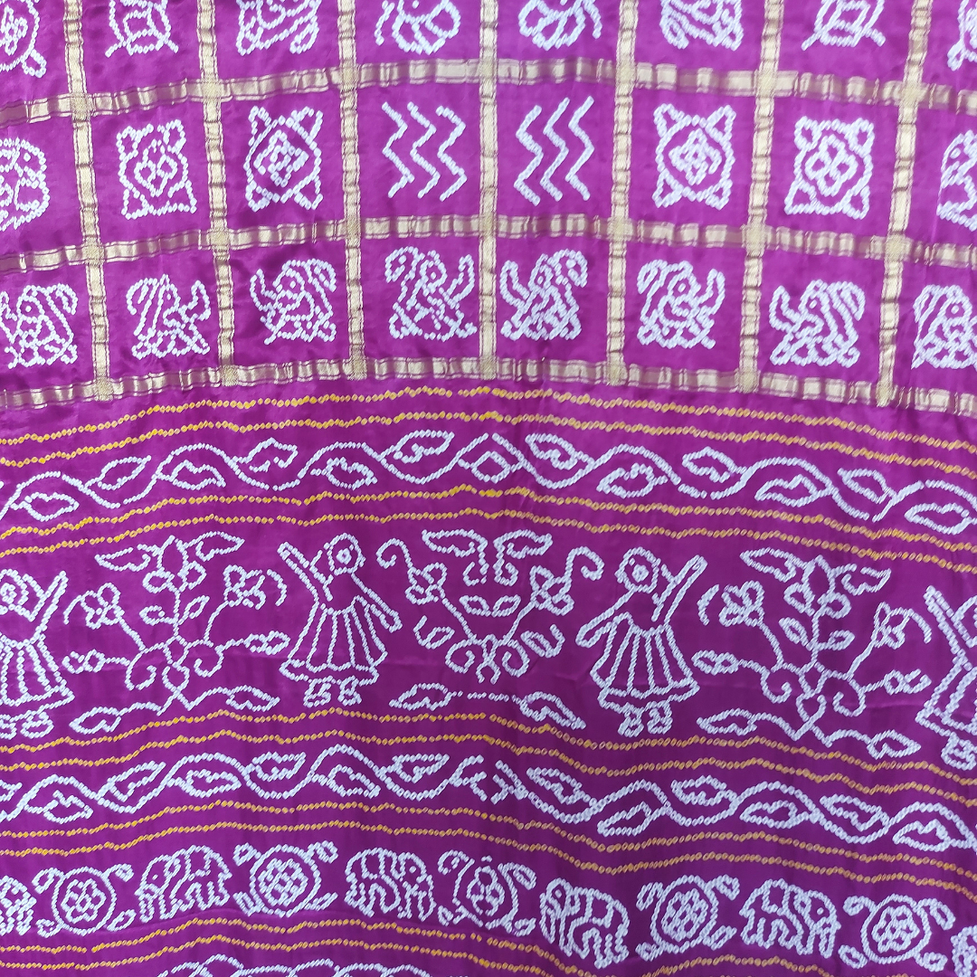 white figure bandhej on purple saree 