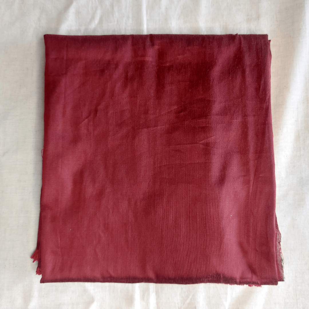 Red fabric square on a white background