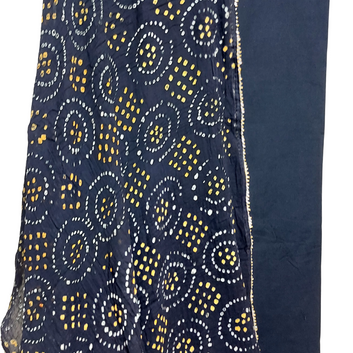 black bandhani dupatta with white and yellow bandhej on flowing on plain black fabric with white background