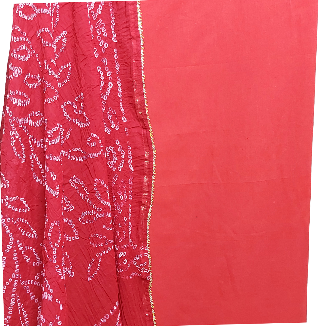 close up of handmade bandhani dupatta with plain red kurta 