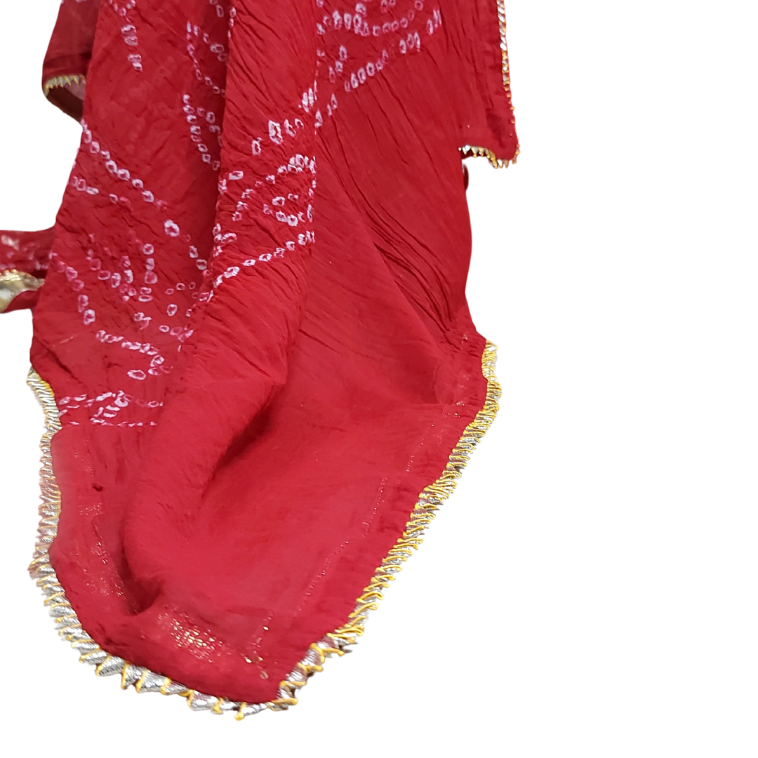 close up of red bandhani dupatta and gotta lace on that.