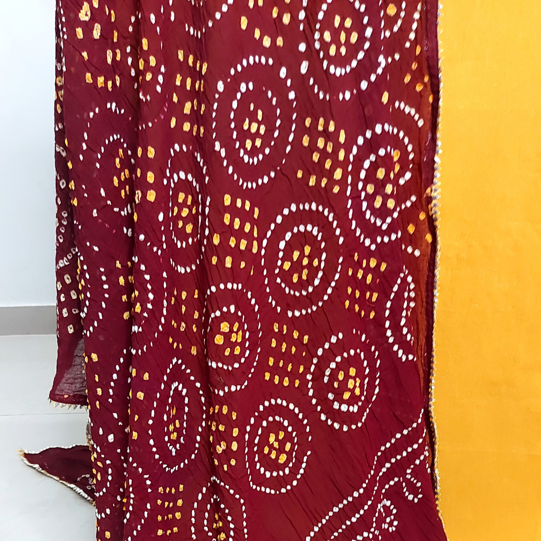 close up of maroon bandhani dupatta