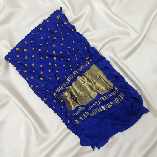 indigo yellow bandhani blouse piece on off white satin background