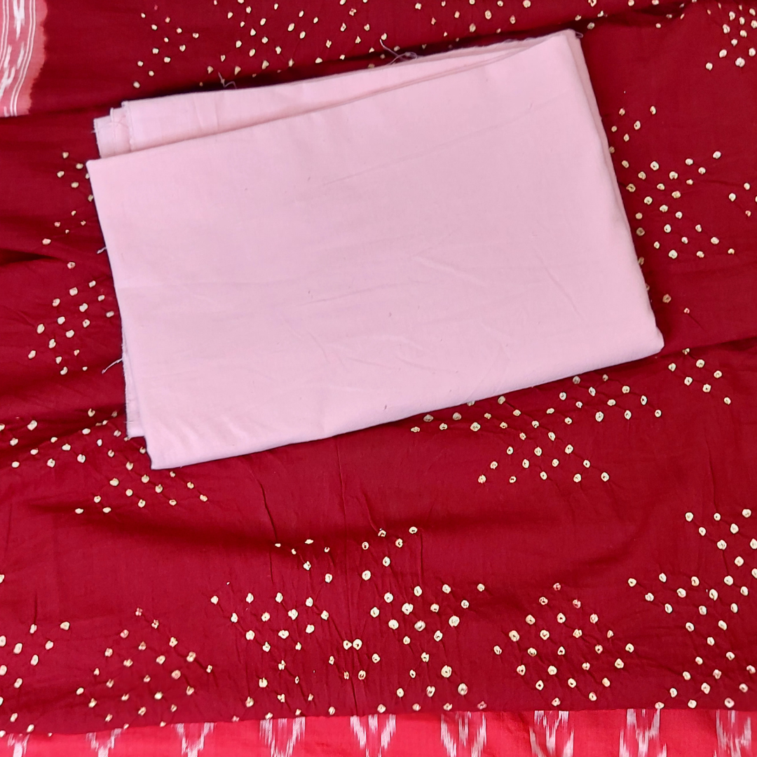 flat lay pink plain fabric on  ikkat bandhani dupatta 