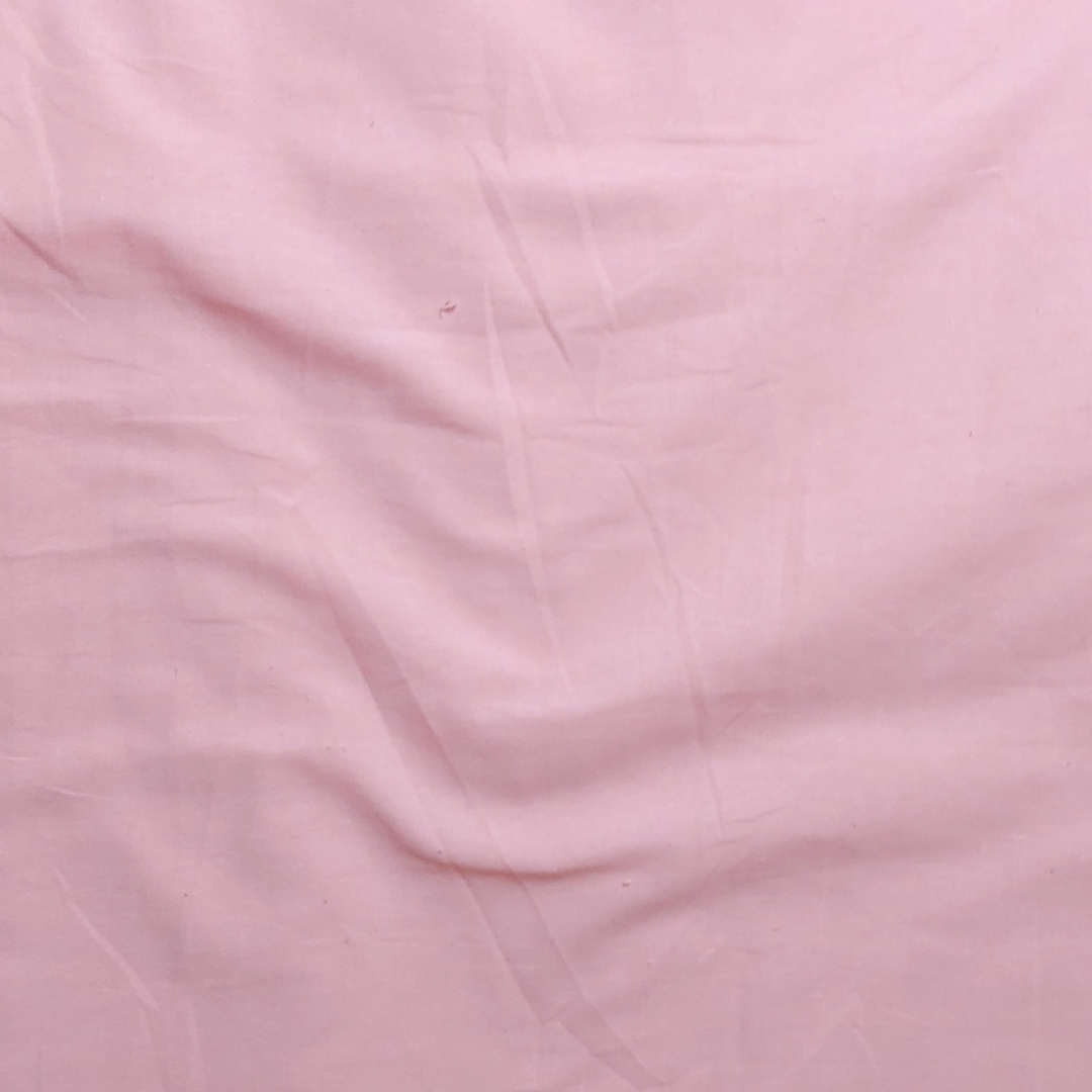 close up of plain pink fabric
