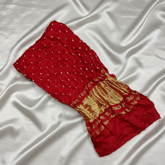 maroon gajji silk bandhani blouse piece on off white satin background