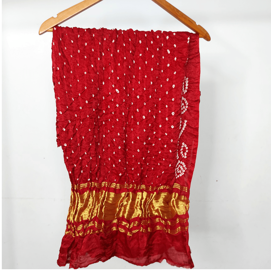 maroon bandhani blouse piece on hanger