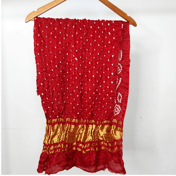 maroon bandhani blouse piece on hanger