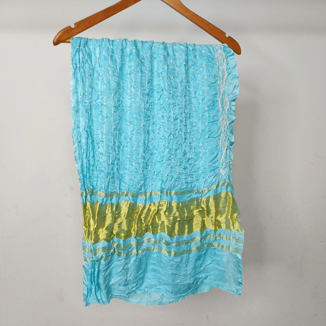 pastel blue bandhani blouse piece on hanger