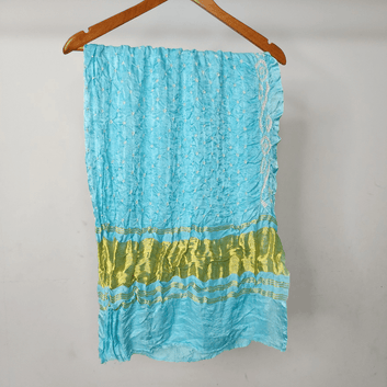 pastel blue bandhani blouse piece on hanger
