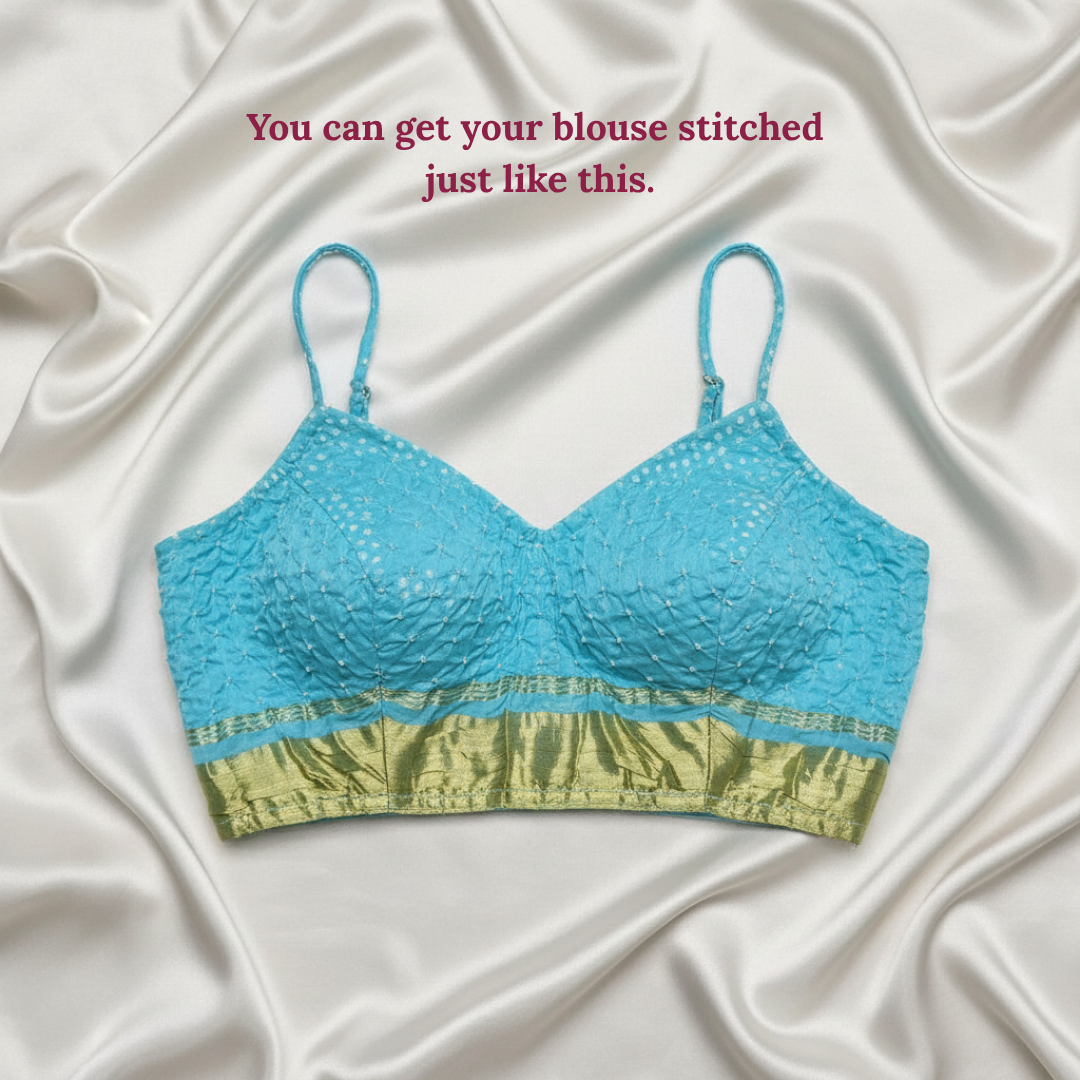Blue and golden blouse on a white fabric background with text.