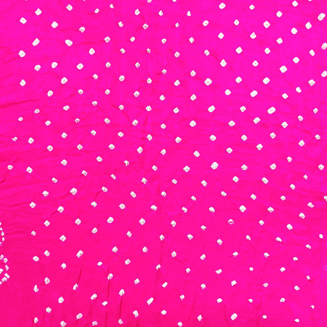 close of bandhani dana bandhani on pink fabric
