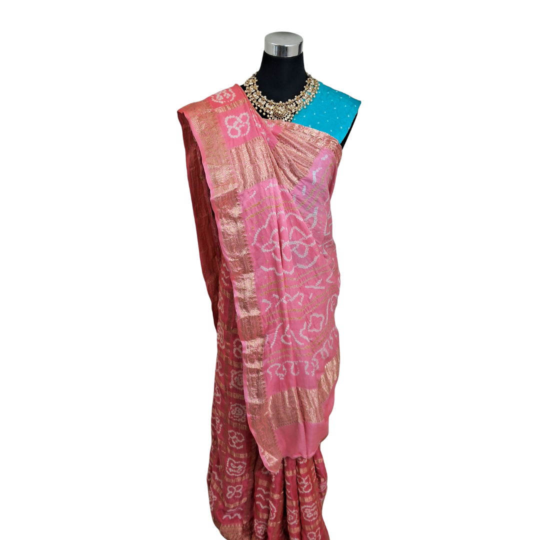 pure gajji silk gharchola bandhani pink Saree blue blouse piece on a mannequin against a white background