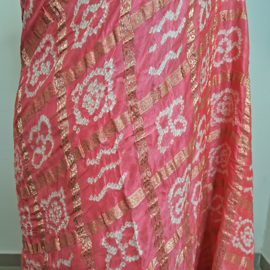 Close-up of a pink pure gajji silk gharachola bandhani saree 