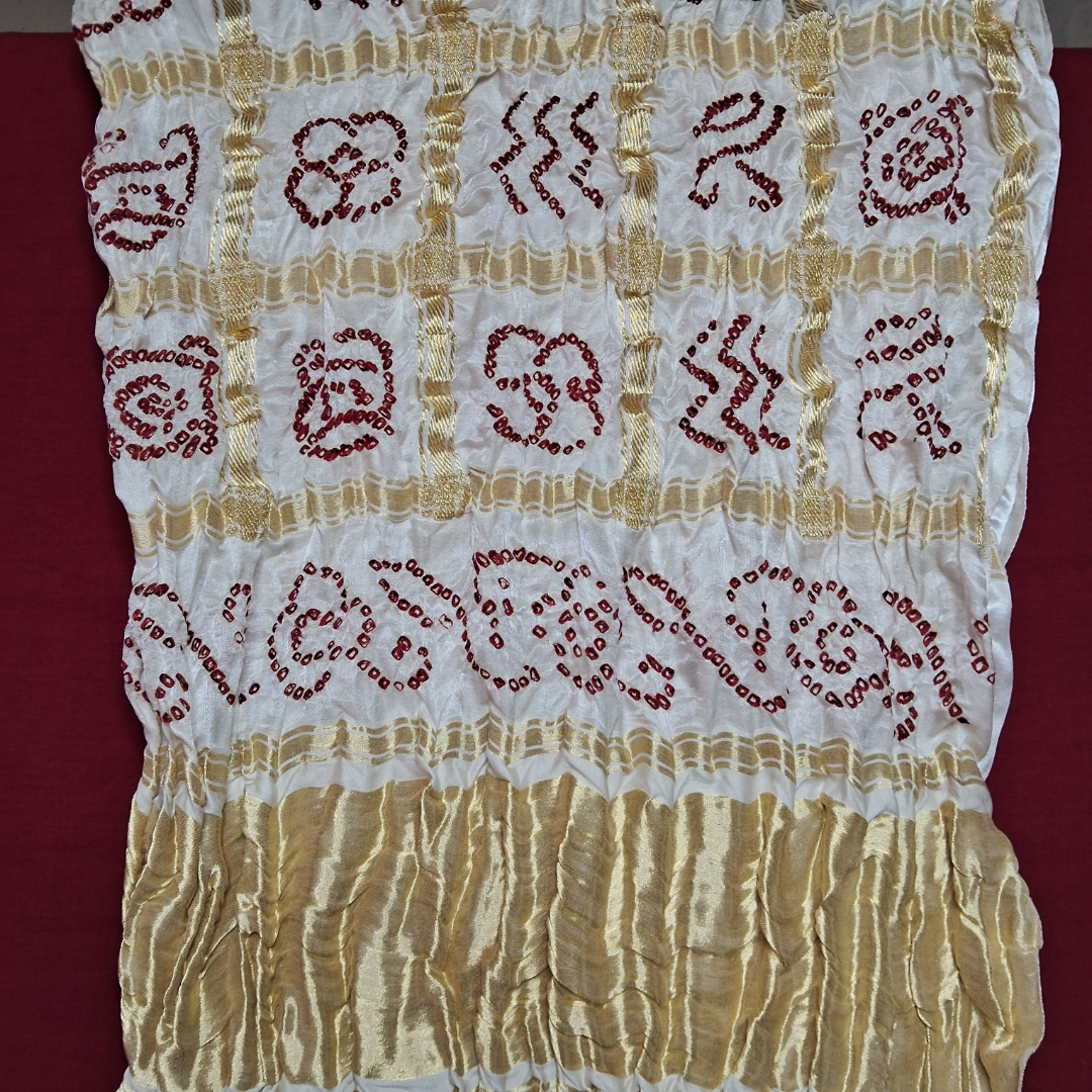 close up of  red bandhani on whitGajji silk gharchola blouse piece 