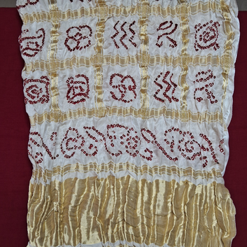 close up of  red bandhani on whitGajji silk gharchola blouse piece 
