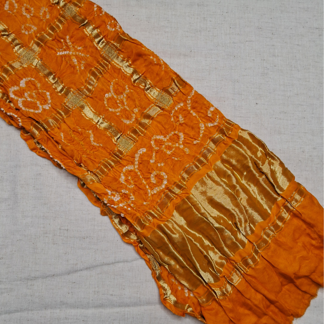 pure gajji silk yellow orange gharchola bandhani blouse piece on white background