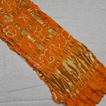 pure gajji silk yellow orange gharchola bandhani blouse piece on white background