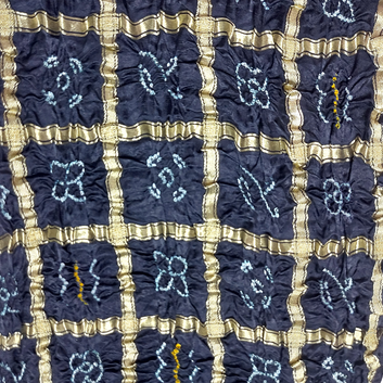 close up of pure gajji silk gharchola bandhani blouse piece with white bandhej