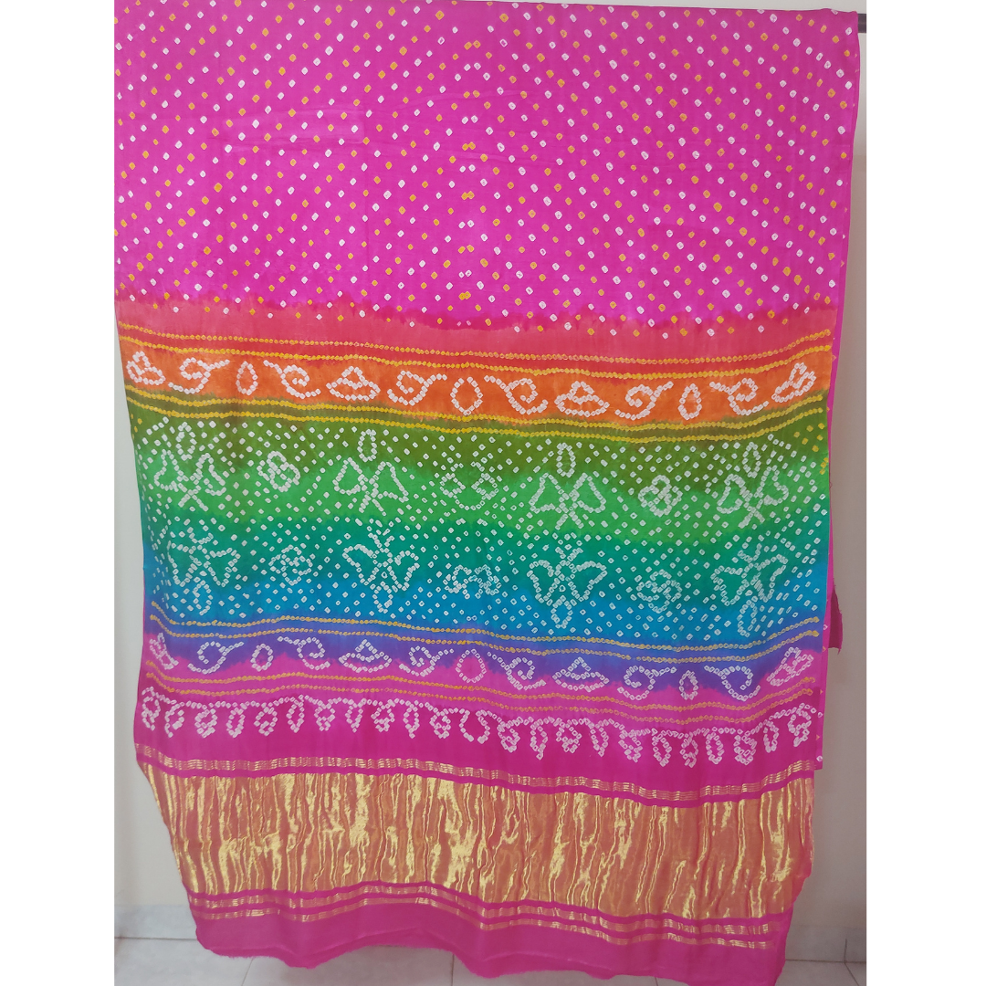 pink bandhani saree with multicolour pallu with white background