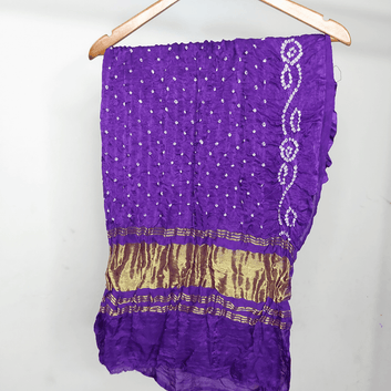 purple bandhani blouse piece on hanger