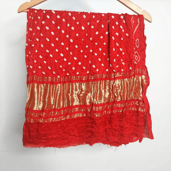 red gajj silk bandhan blouse piece on hanger