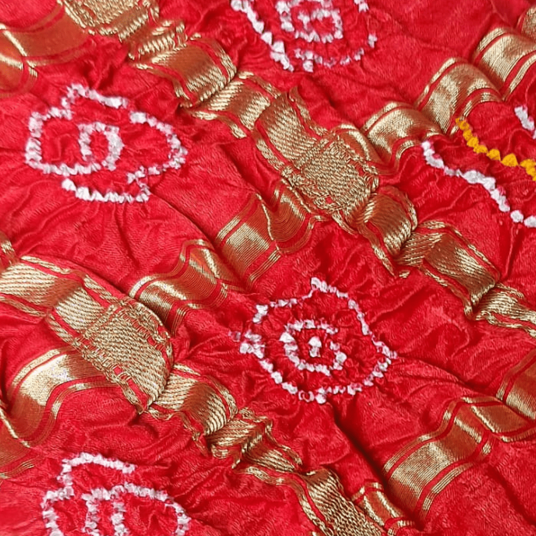 close up of red ghachola bandhani blouse piece