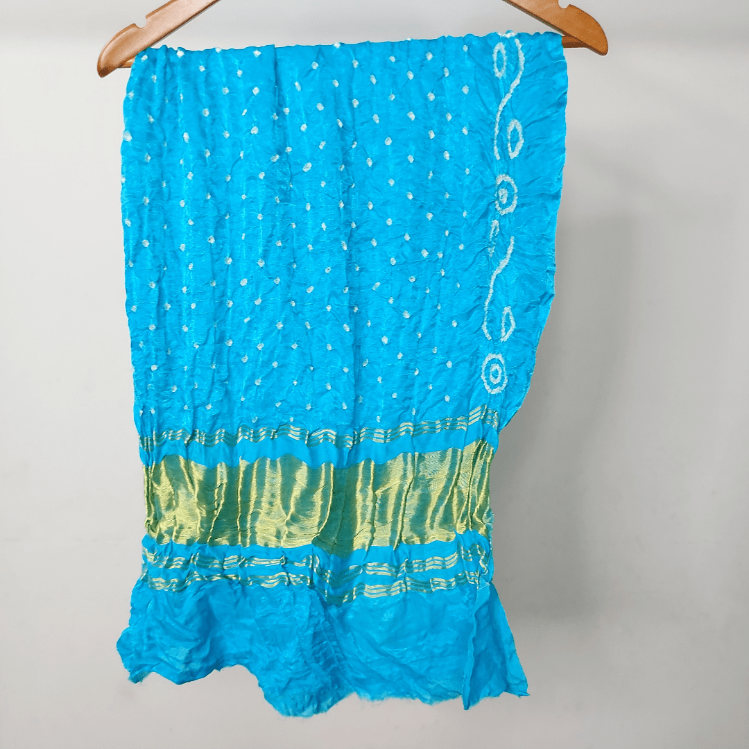 skyblue bandhani blouse piece on hanger