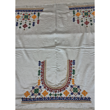 An off-white or cream-colored blouse fabric featuring detailed, colorful hand-embroidered geometric patterns, including a large U-neckline design and matching motifs on the shoulders.
